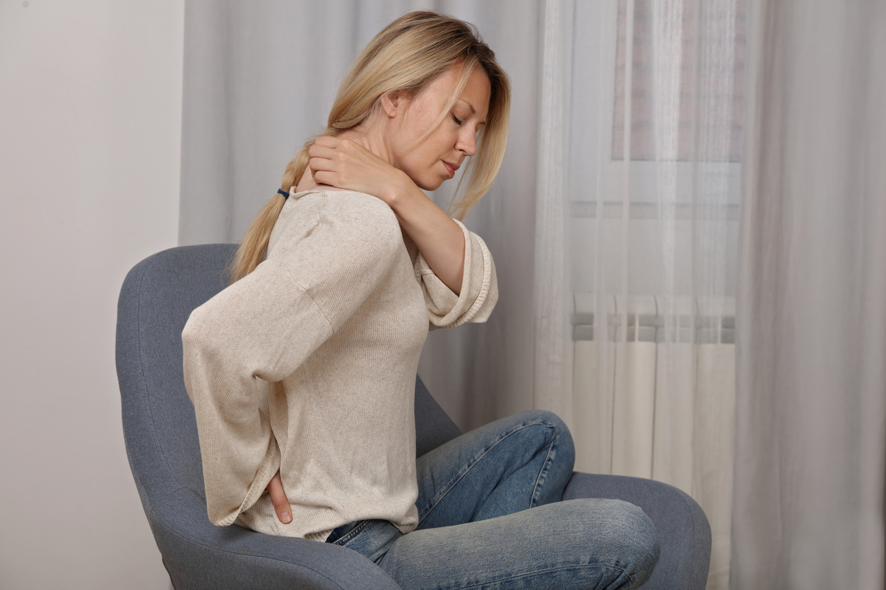 Woman suffering from back and neck pain as the featured image for How Effective Is Spinal Decompression